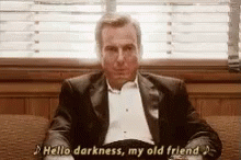 Gif of Will Arnett in Arrested Development with "Hello Darkness my old friend" written as the caption.